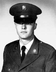 A black and white image showing the head and upper torso of Sasser wearing his military dress uniform with ribbons.