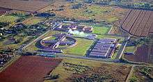 Aerial view of a walled prison facility